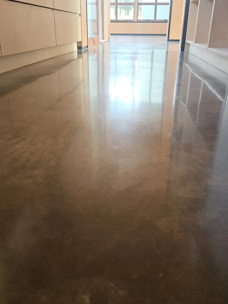 Warm-toned polished floor, kitchen and living
